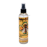 Honey-B-Gon spray bottle with bee design on a white background
